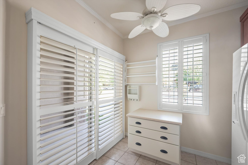 Spacious closet featuring ceiling fan and light tile patterned floors
