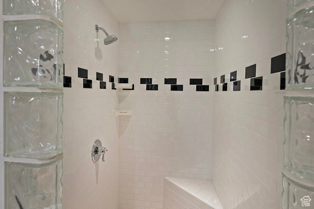 Full bath with a tile shower