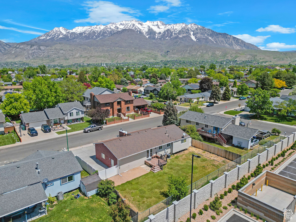 Aerial view of residential area featuring a mountain backdrop