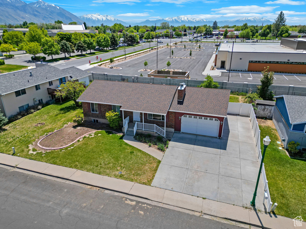 Aerial view of property and surrounding area with mountains