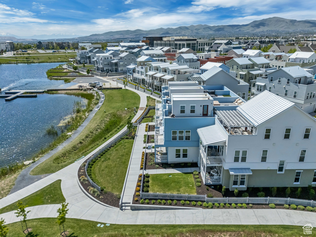 Aerial view of residential area featuring a water and mountain view