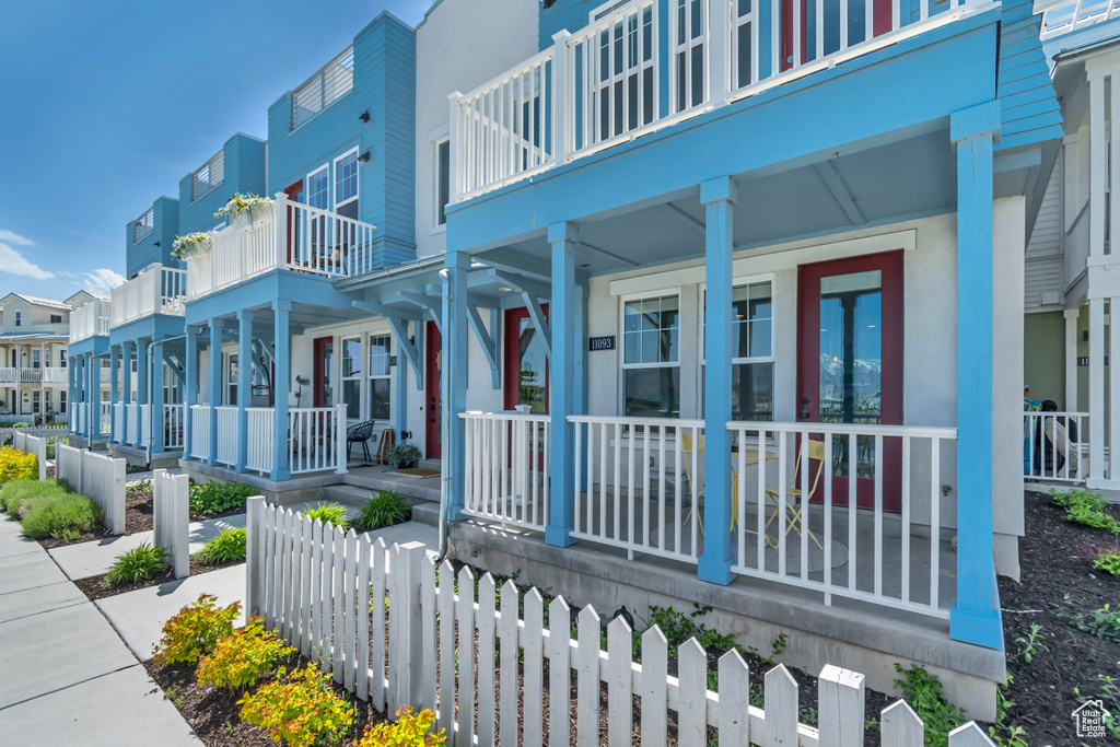 View of community featuring fence and a residential view