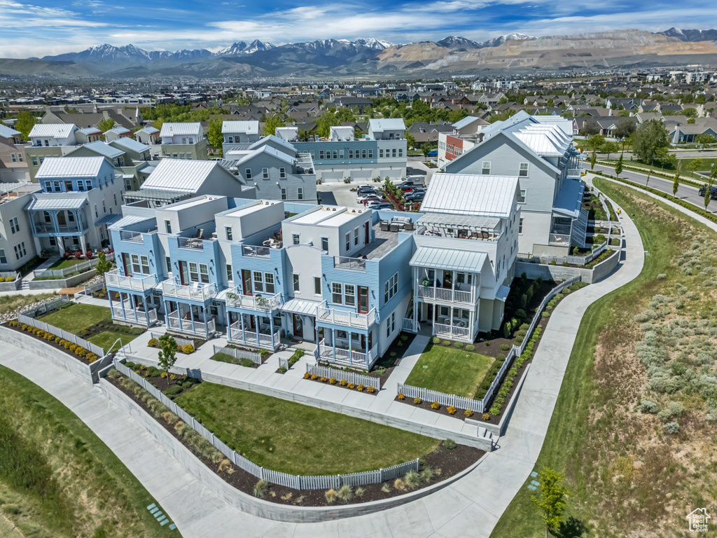 Aerial view of residential area featuring mountains