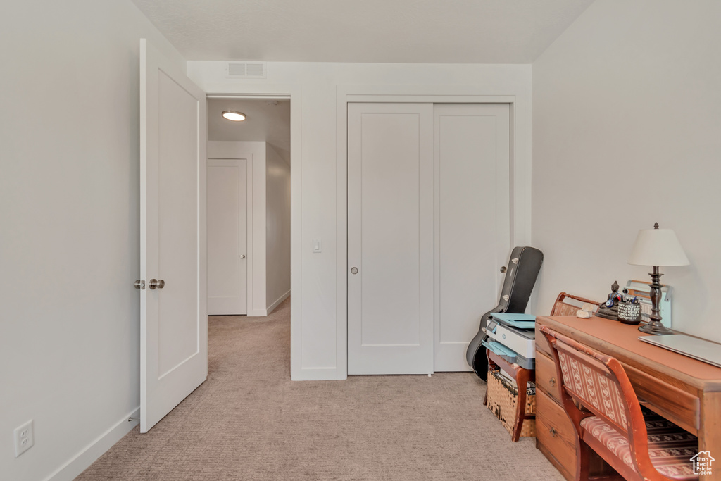 Office with light colored carpet