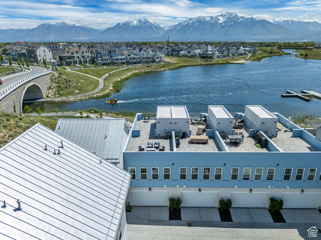 Aerial perspective of suburban area with a water and mountain view