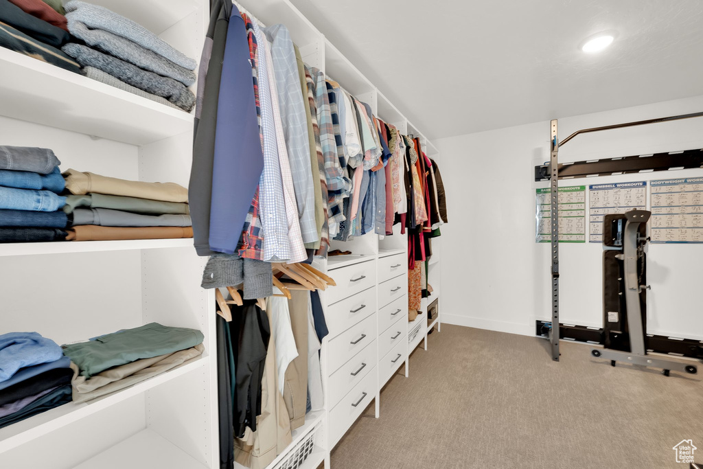 Walk in closet with carpet flooring