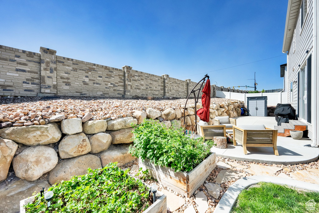 Fenced backyard with a patio