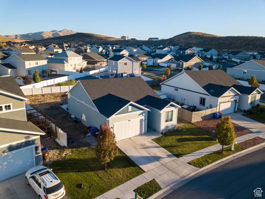 Aerial view of residential area with a mountainous background