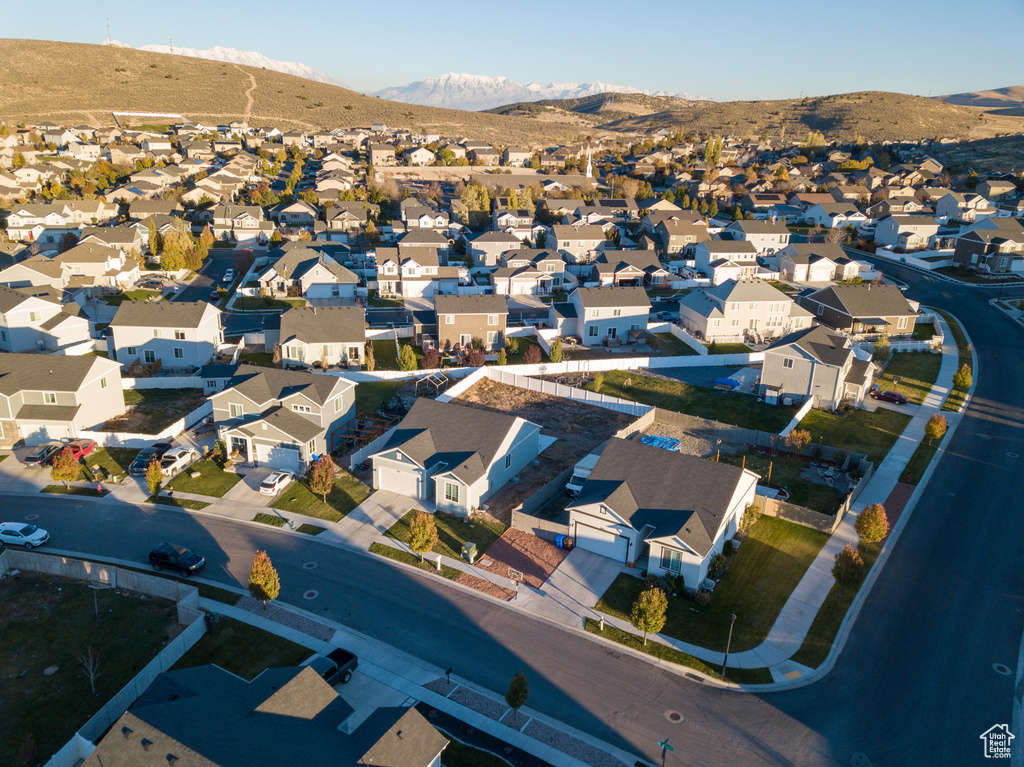 Aerial view of residential area with a mountainous background