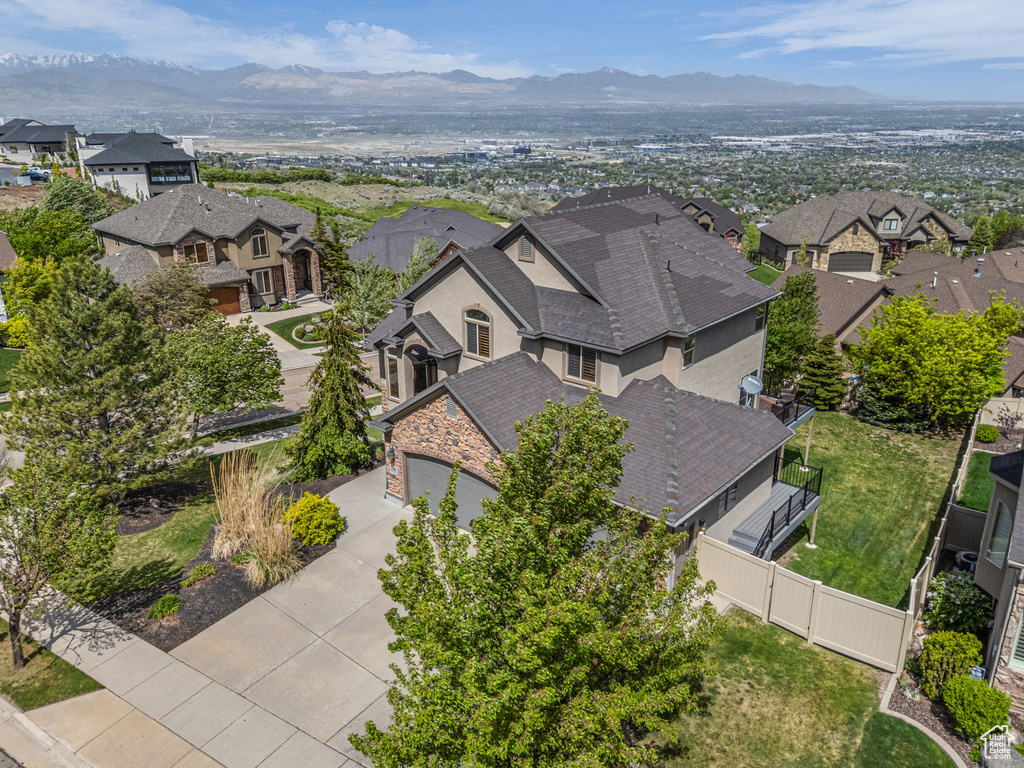Aerial perspective of suburban area with a mountainous background