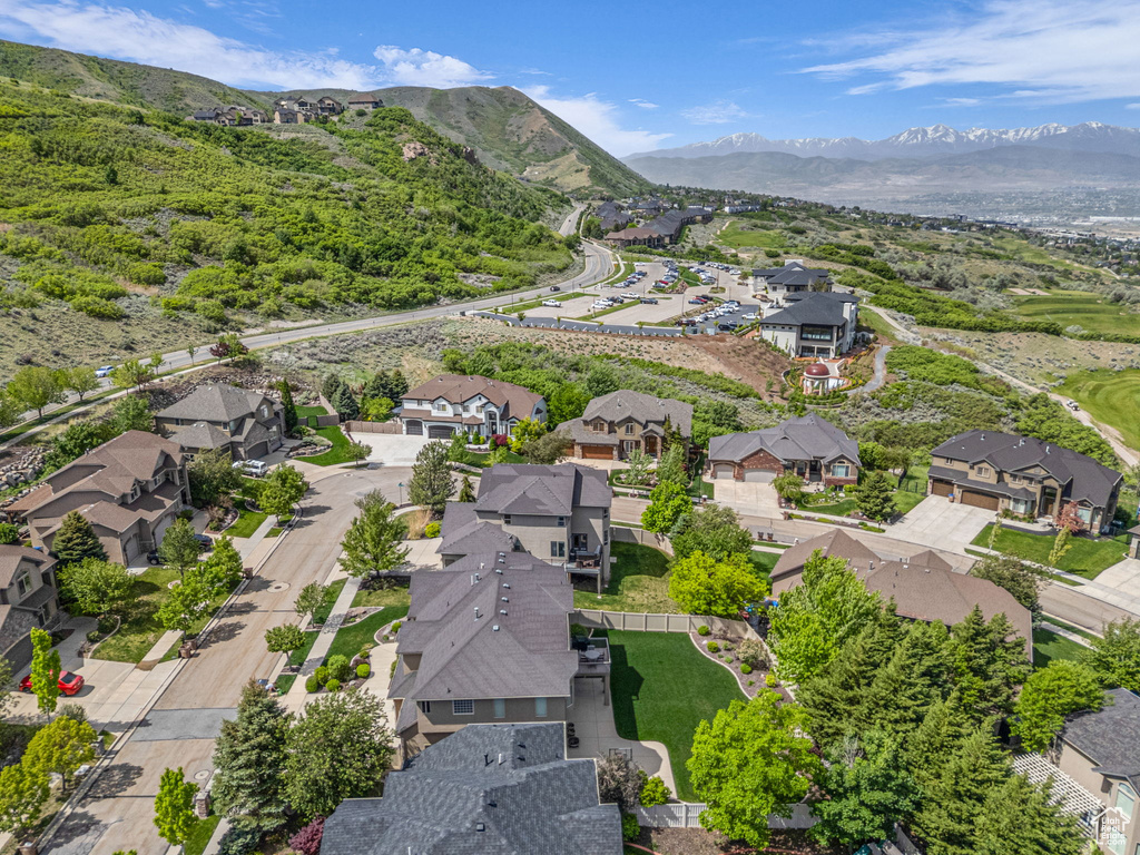 Aerial perspective of suburban area featuring a mountainous background
