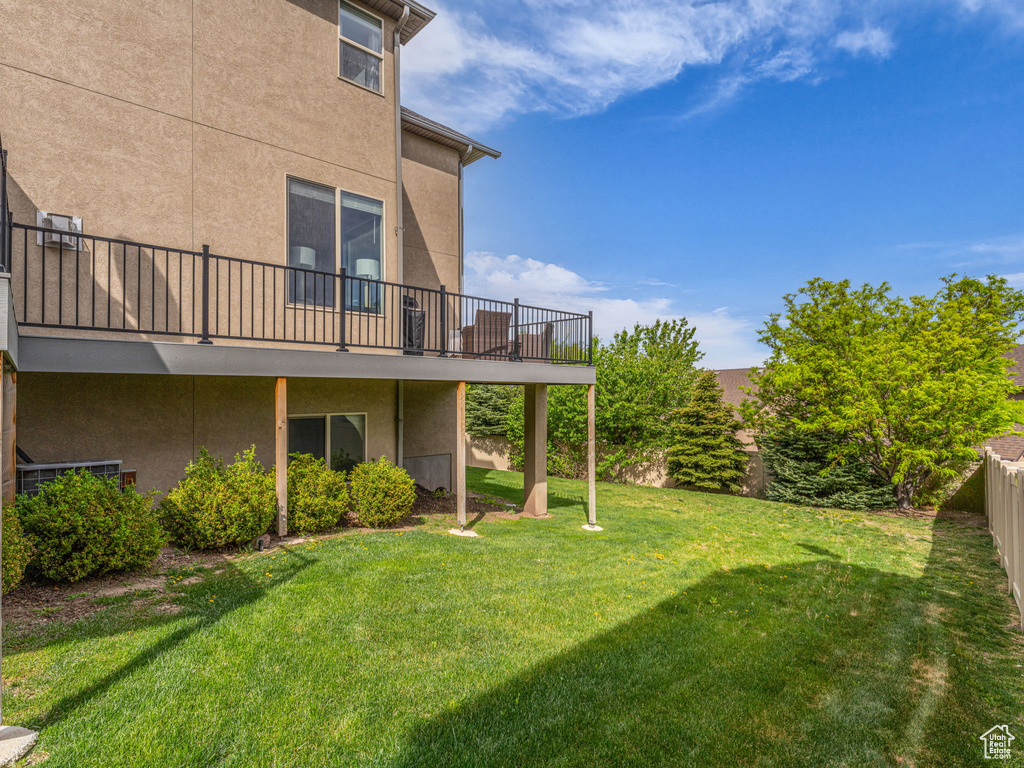 View of yard with a wooden deck