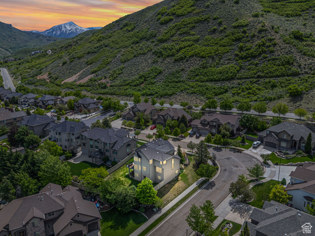 Aerial perspective of suburban area with a mountain backdrop