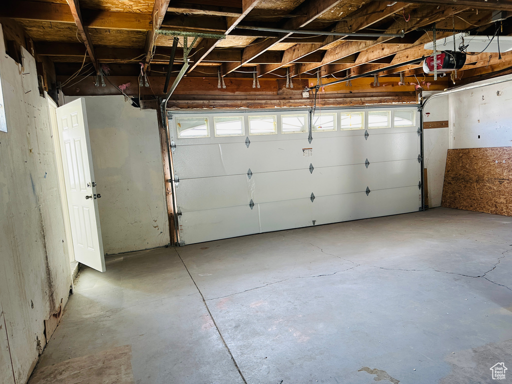 Garage featuring a garage door opener