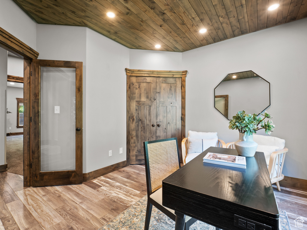 Dining room with recessed lighting, baseboards, light wood-style flooring, and wooden ceiling