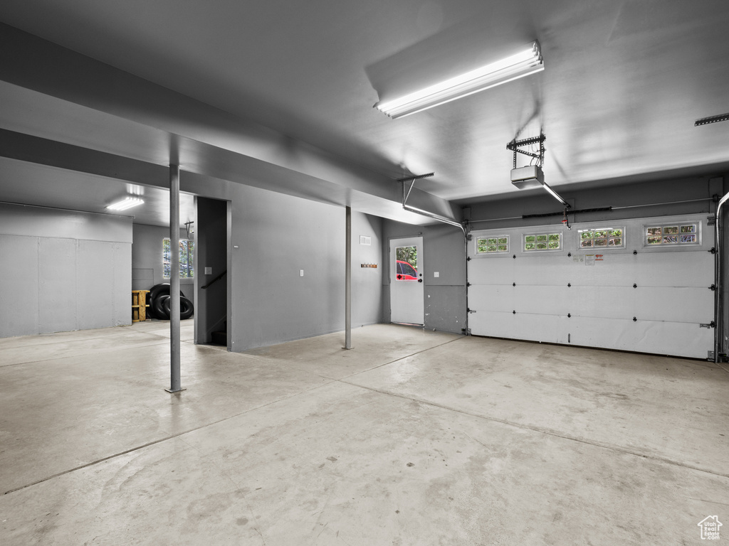 Garage featuring a garage door opener
