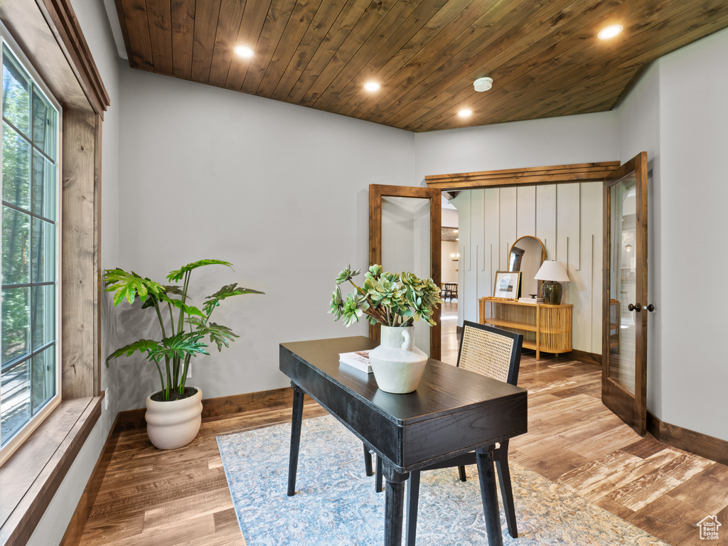 Office with baseboards, recessed lighting, light wood-style floors, wooden ceiling, and french doors