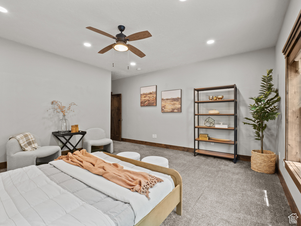 Carpeted bedroom featuring recessed lighting, baseboards, and a ceiling fan