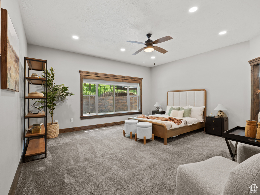 Carpeted bedroom featuring recessed lighting, baseboards, and ceiling fan