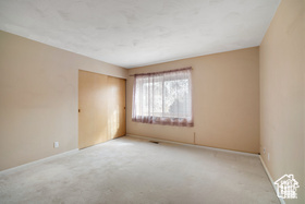 Spare room with carpet flooring and baseboards