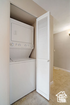 Laundry room with estacked washer and dryer