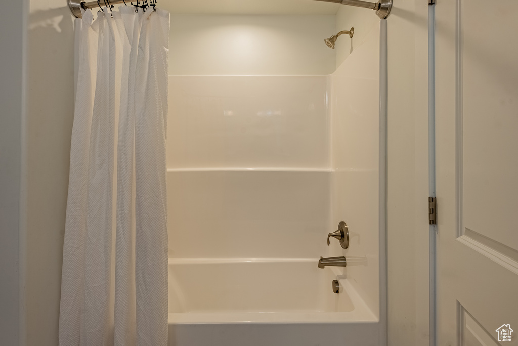 Full bath featuring shower / tub combo