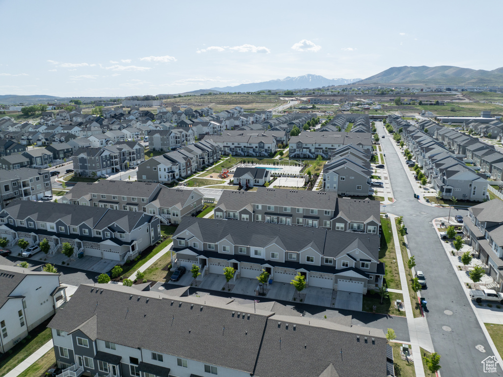 Aerial view of residential area with a mountainous background