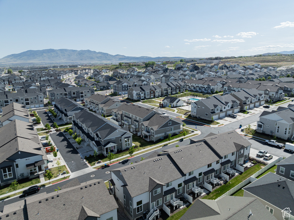 Aerial perspective of suburban area featuring mountains and property parcel outlined