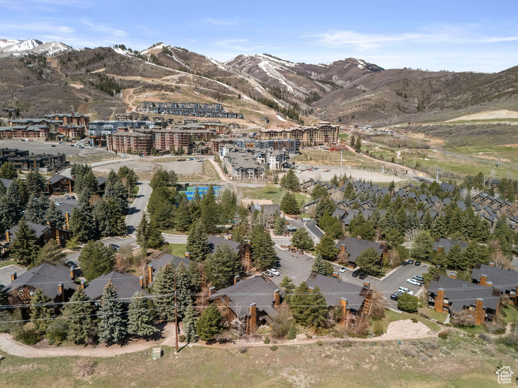 Aerial view of property and surrounding area with mountains