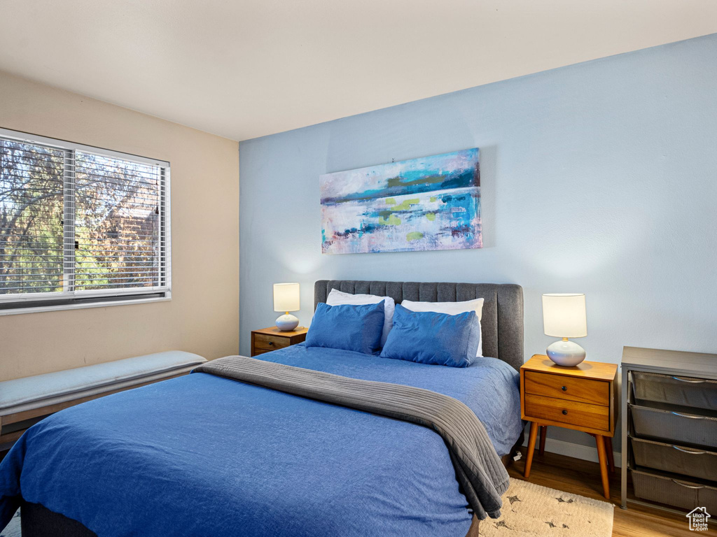 Bedroom with wood finished floors