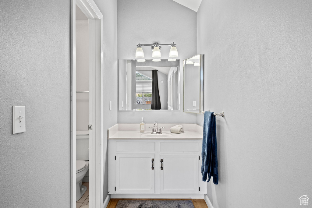 Bathroom featuring toilet and vanity