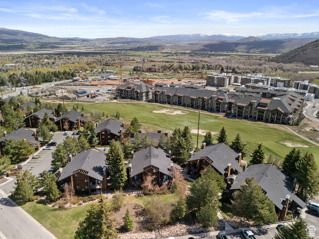View of property location with a mountain backdrop, nearby suburban area, and a golf club