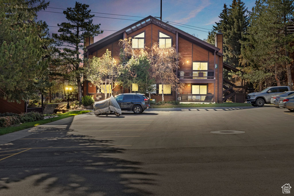 View of property at dusk