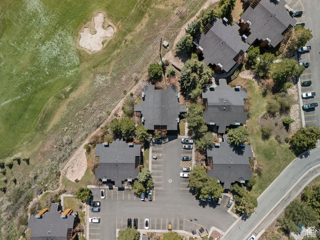 Aerial view of property and surrounding area with nearby suburban area
