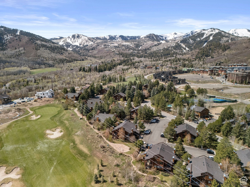 Aerial view of a mountainous background and a golf club