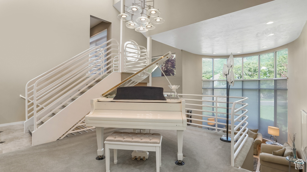 Living area with stairway, carpet floors, and recessed lighting