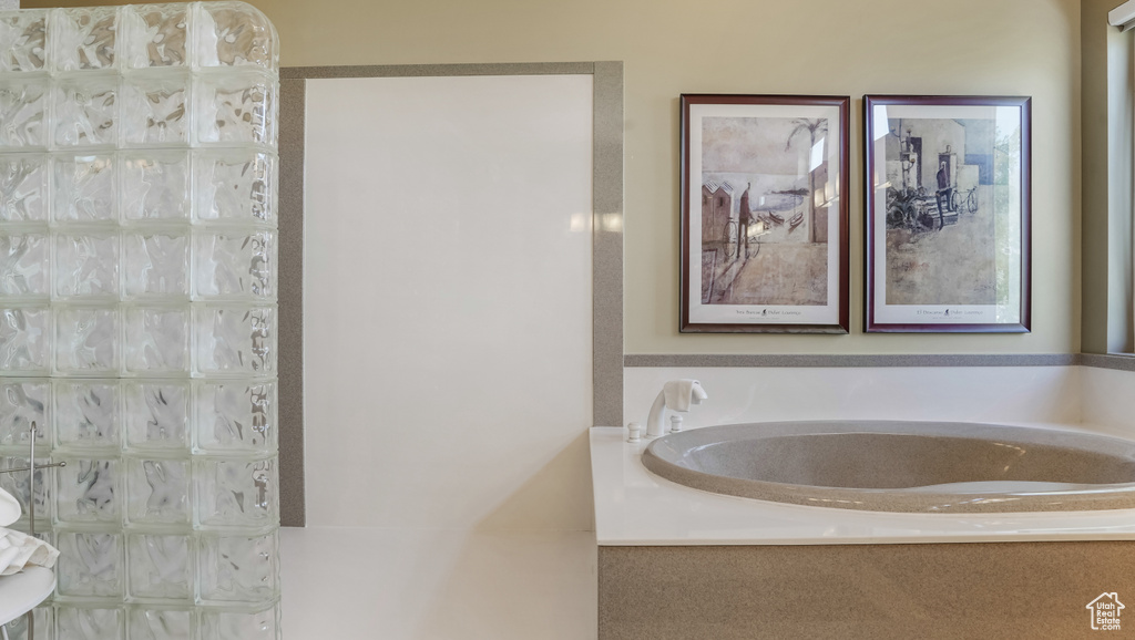 Full bathroom with a garden tub