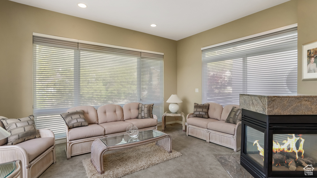 Carpeted living room featuring recessed lighting