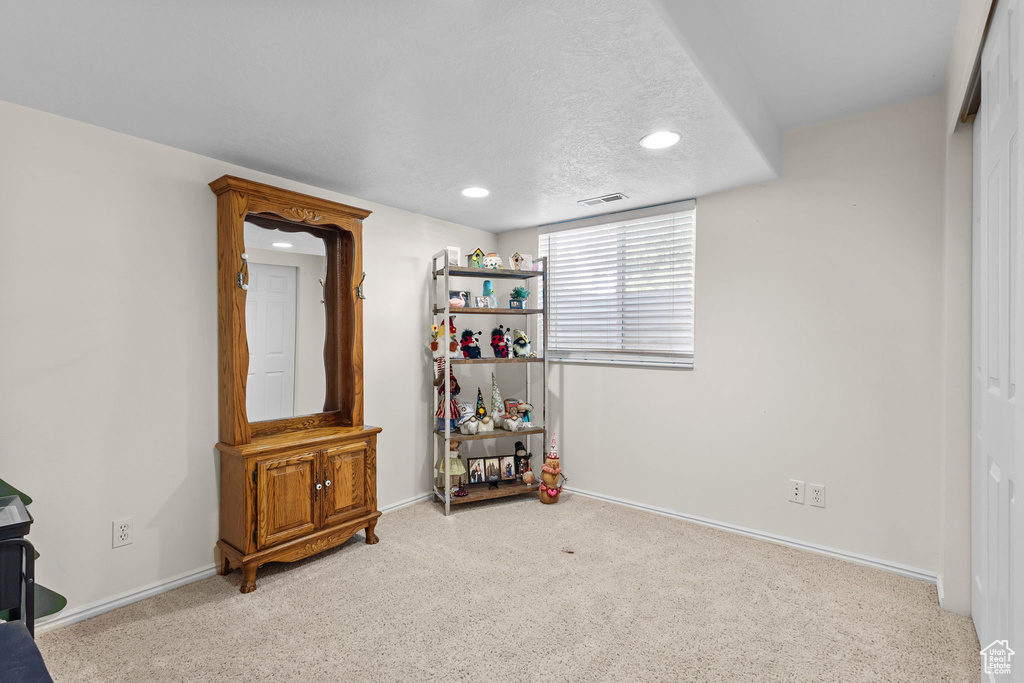 Carpeted bedroom with recessed lighting and baseboards