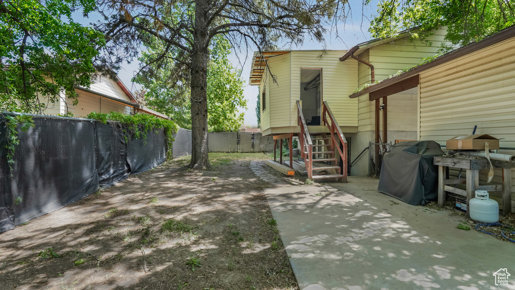 View of patio / terrace featuring a fenced backyard and a grill