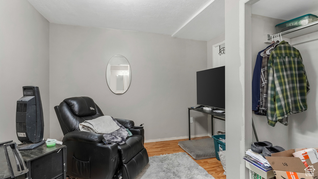 Sitting room featuring wood finished floors and baseboards