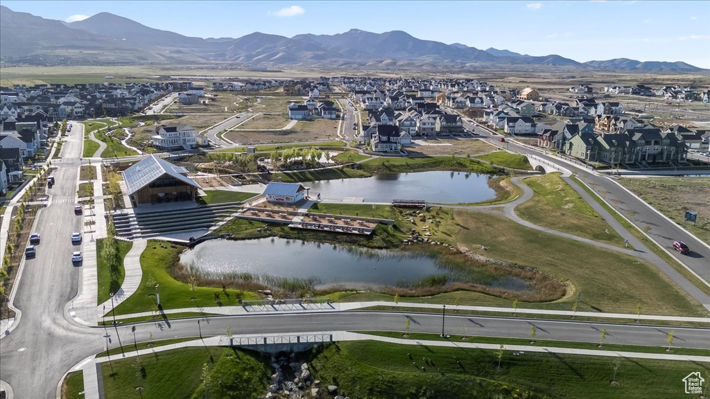 View of property location with nearby suburban area and a water and mountain view