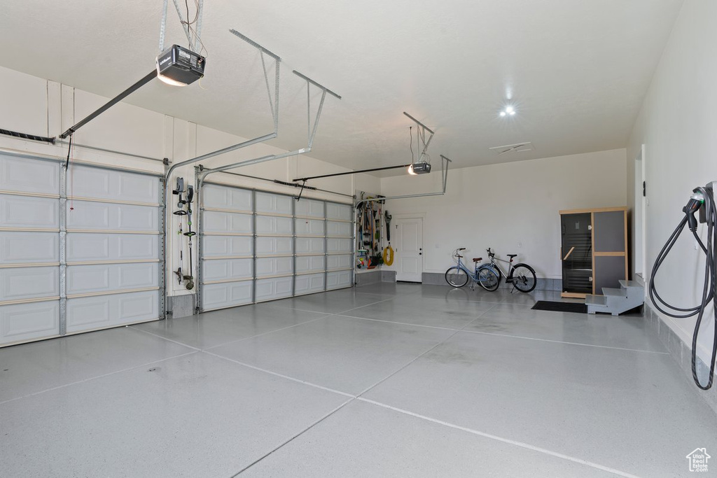 Garage featuring a garage door opener