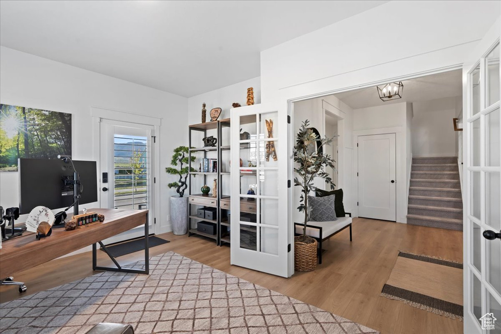Office featuring wood finished floors and french doors