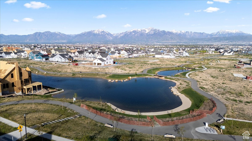Aerial perspective of suburban area featuring a water and mountain view