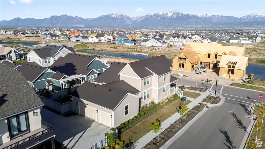 Aerial perspective of suburban area featuring a water and mountain view