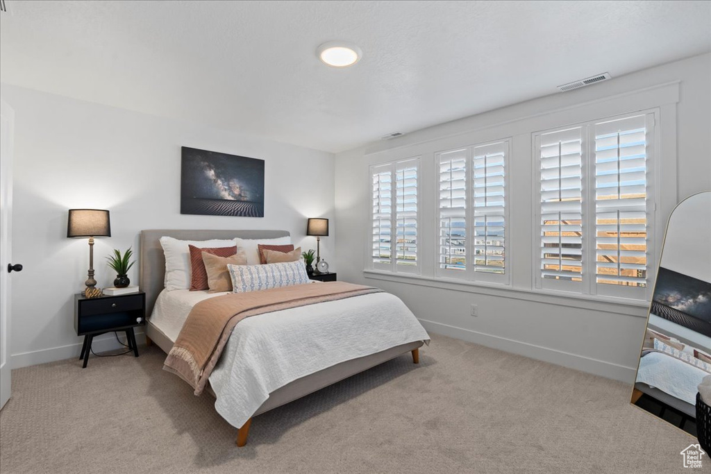 Carpeted bedroom with baseboards