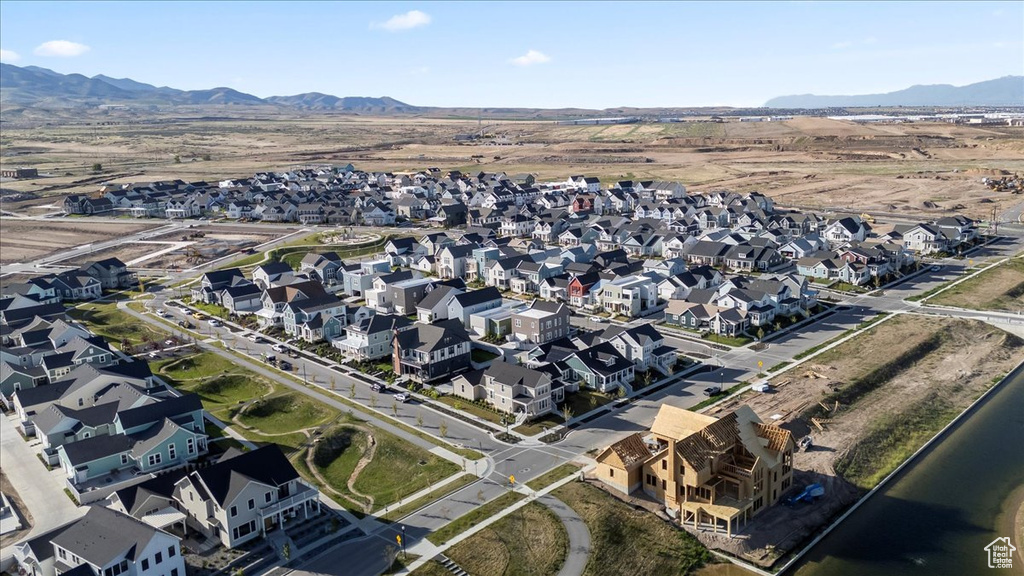 View of property location featuring mountains and nearby suburban area