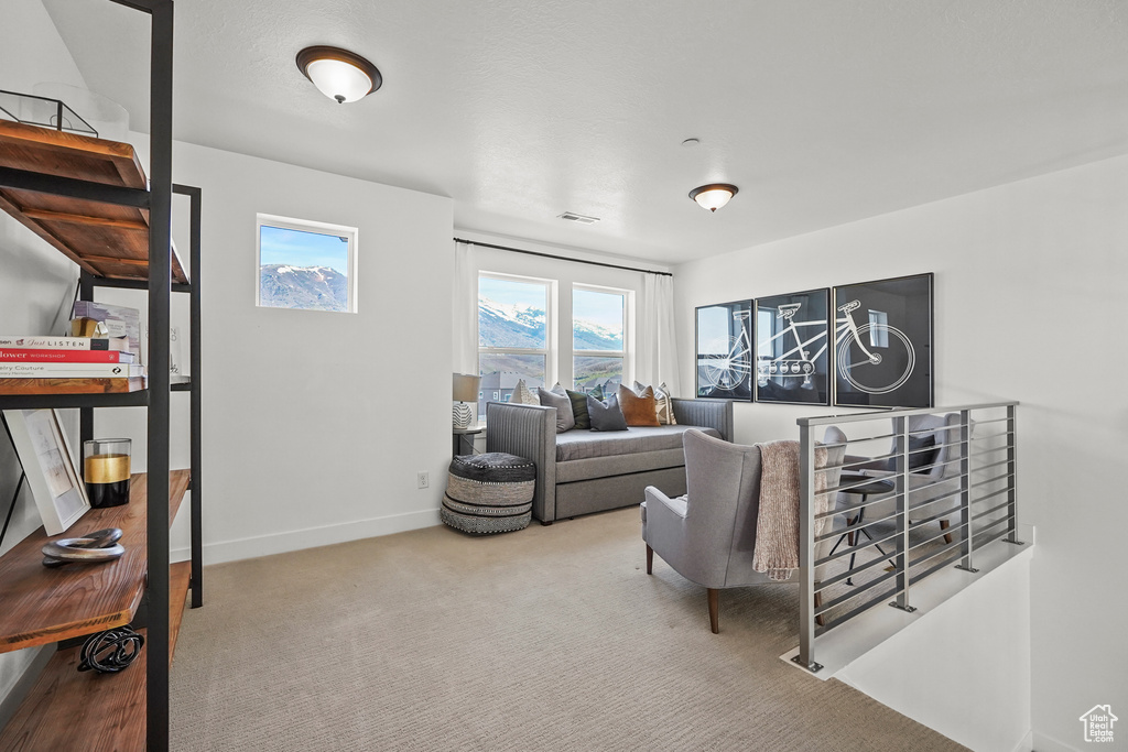 Carpeted living room with baseboards