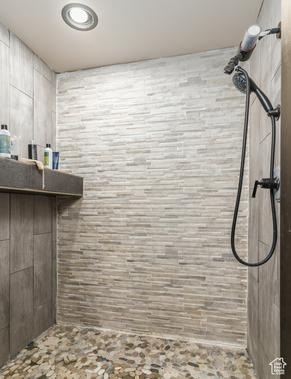 Full bathroom with a tile shower